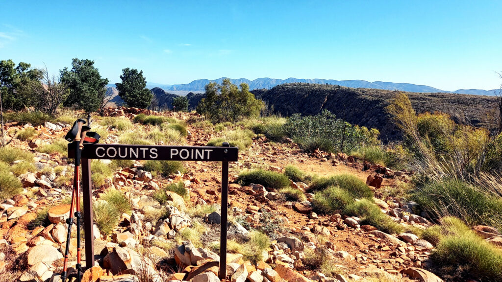 Counts Point sign with walking sticks on the Larapinta Trail