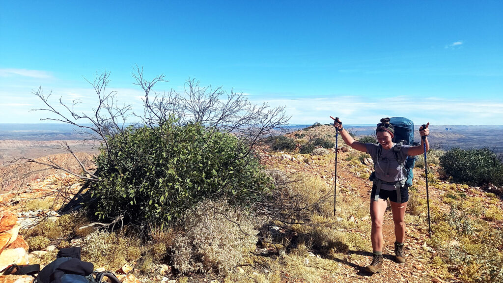 Jesse Leigh arriving on top of Brinkley Bluff - The Larapinta Trail