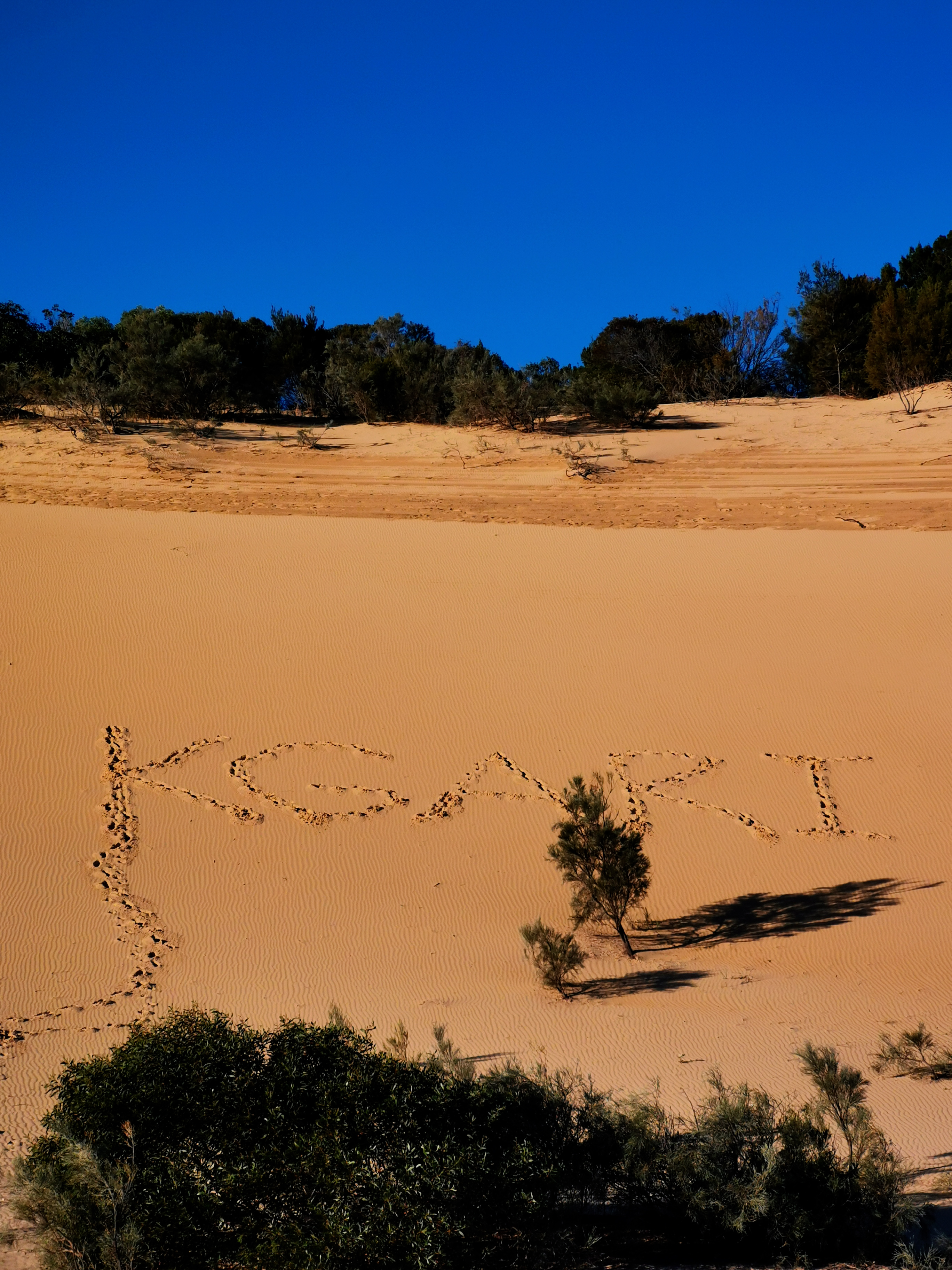K'gari written in the sand dunes 