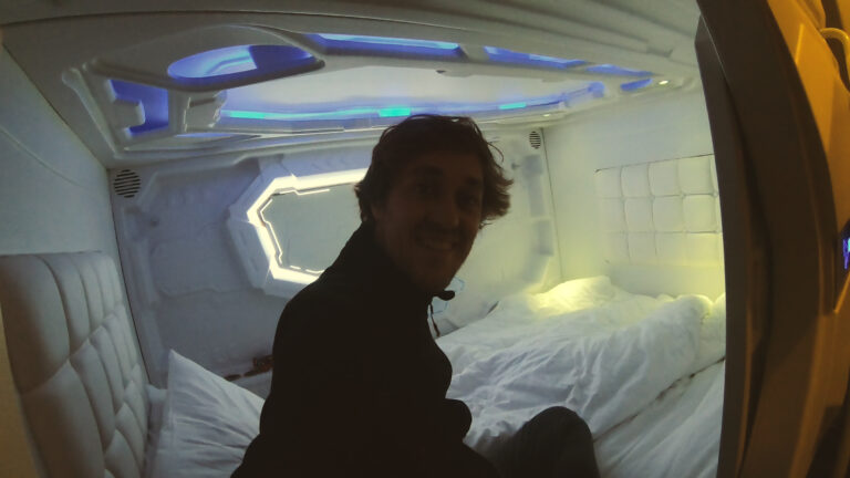 Yentl Doggen inside a sleeping capsule at the Pod Inn, Launceston