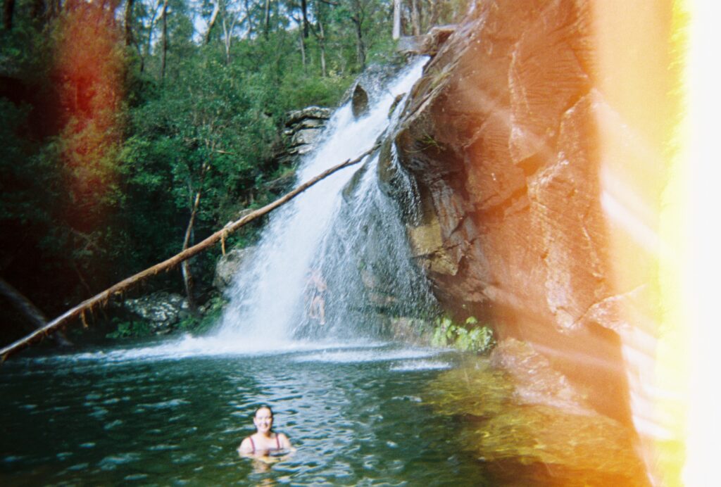 Avalon swimming in waterfall