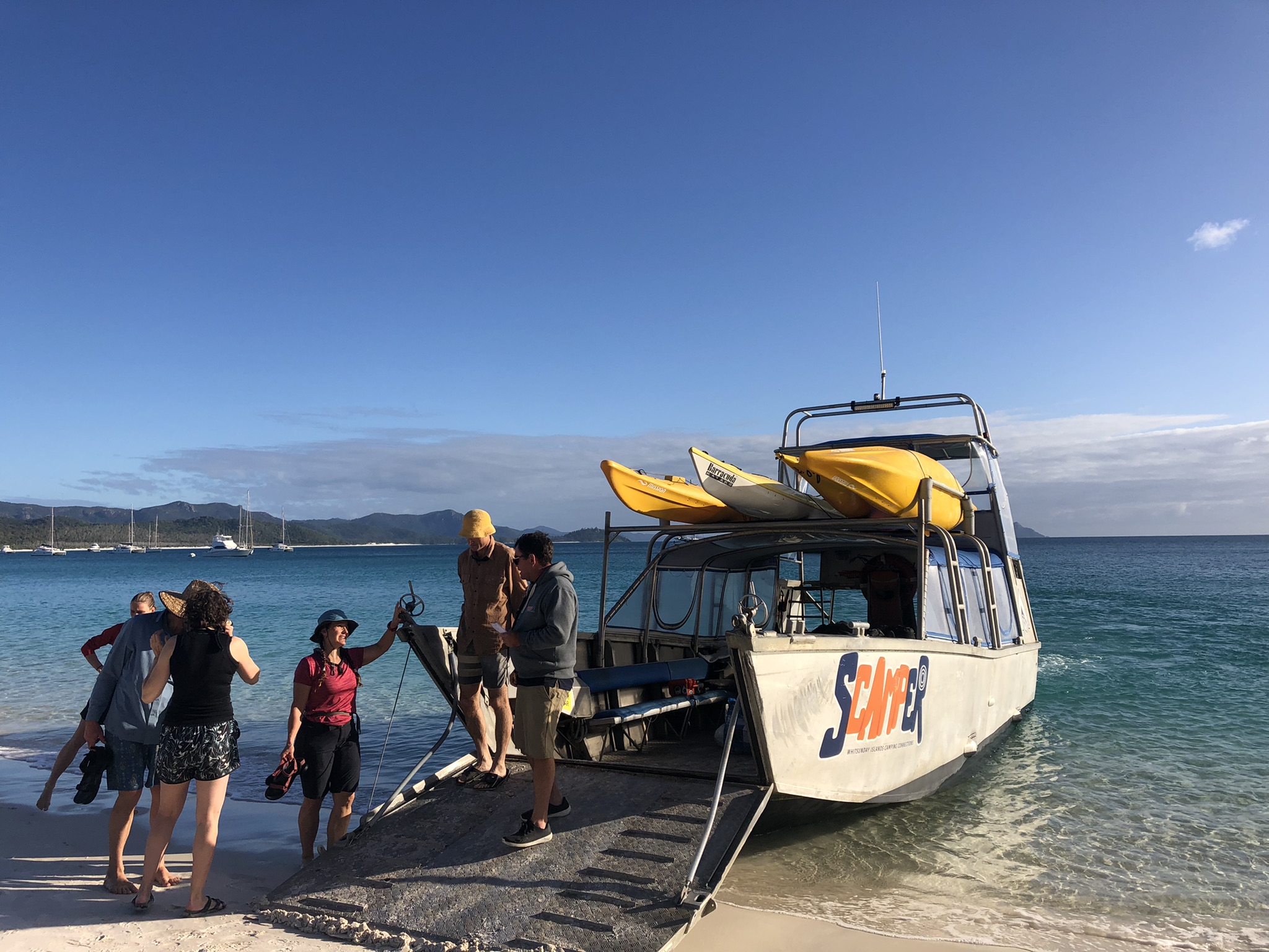 Scamper boat pulls up on Whitehaven Beach